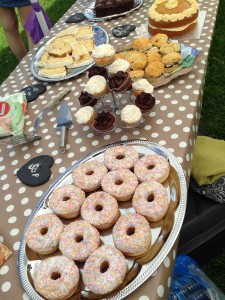 lots of yummy doughnuts and cakes on plates